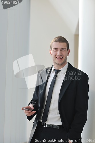 Image of young business man talk by cellphone