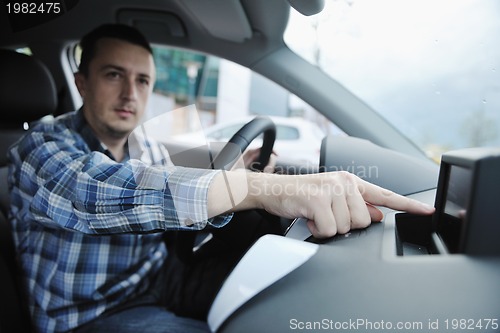 Image of man using car navigation