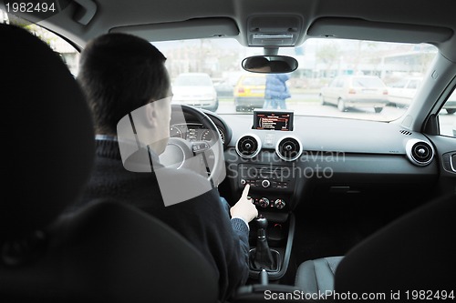 Image of man using car navigation