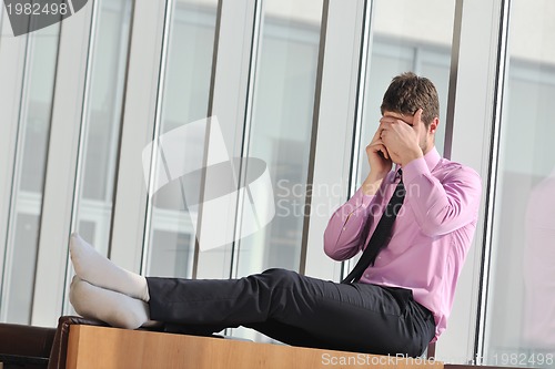 Image of young business man talk by cellphone