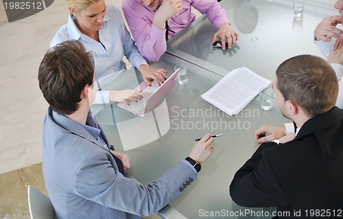 Image of group of business people at meeting