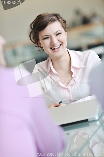 Image of young business woman on meeting