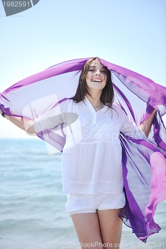 Image of young woman relax  on beach