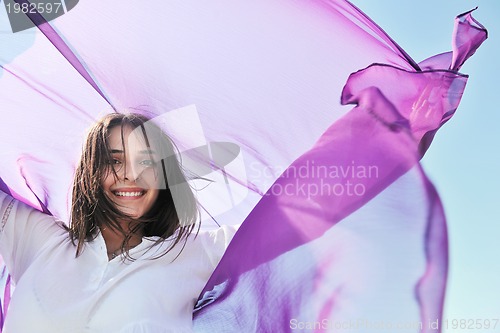 Image of young woman enjoy on beach