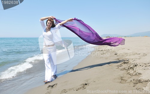 Image of young woman relax  on beach