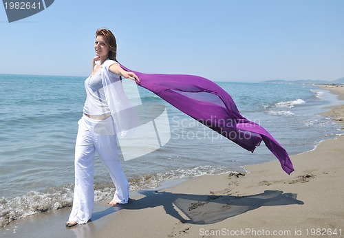 Image of young woman relax  on beach