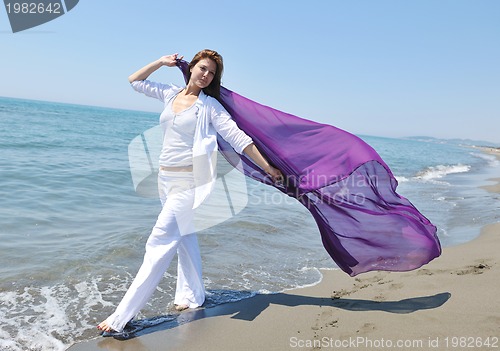 Image of young woman relax  on beach