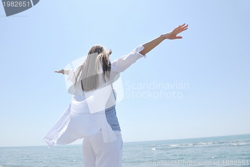 Image of young woman relax  on beach