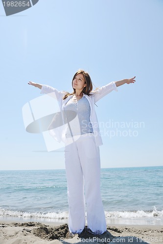 Image of young woman relax  on beach