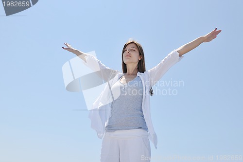 Image of young woman relax  on beach