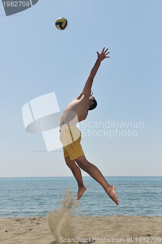 Image of male beach volleyball game player