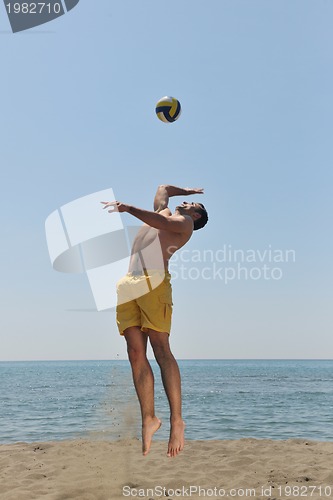 Image of male beach volleyball game player