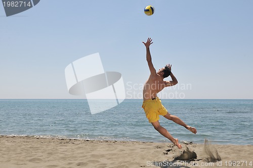 Image of male beach volleyball game player