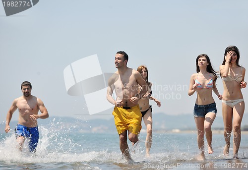 Image of happy young  people group have fun on beach