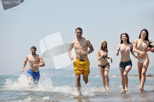 Image of happy young  people group have fun on beach