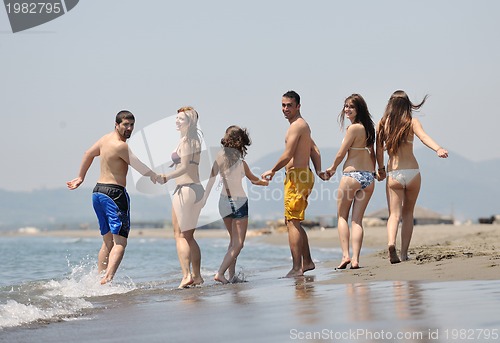 Image of happy young  people group have fun on beach