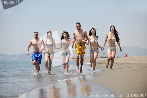 Image of happy young  people group have fun on beach