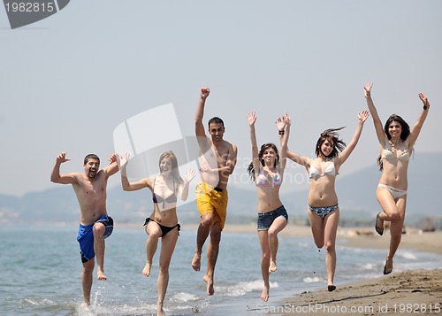 Image of happy young  people group have fun on beach