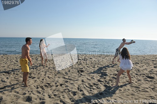 Image of young people group have fun and play beach volleyball