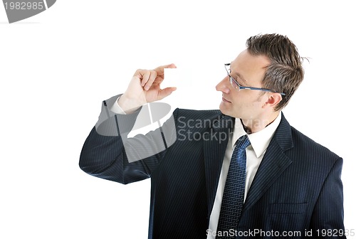Image of young businessman with empty white card