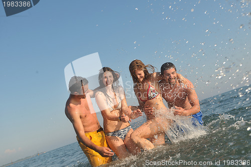 Image of happy people group have fun and running on beach