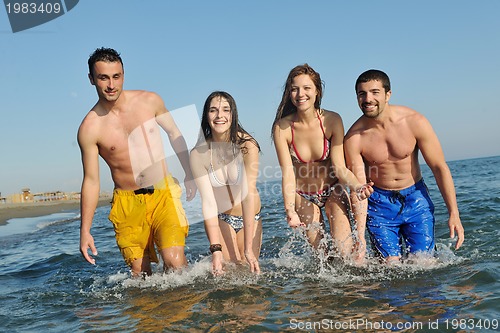 Image of happy young  people group have fun on beach