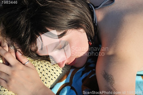 Image of young woman relax  on beach