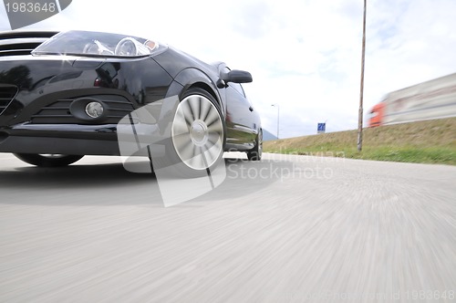 Image of Fast car moving with motion blur