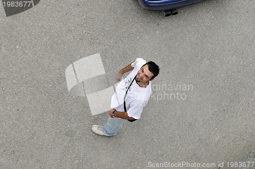 Image of young man looking up