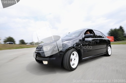 Image of Fast car moving with motion blur