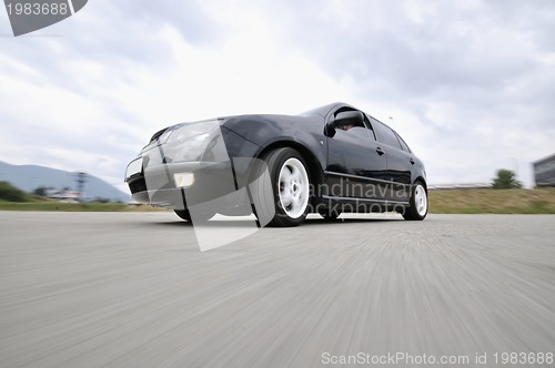 Image of Fast car moving with motion blur