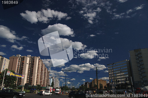 Image of traffic in the city and blue sky with dramatic clouds