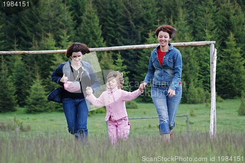 Image of happy girls running in nature