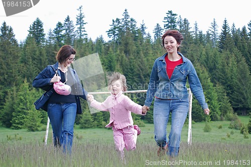 Image of happy girls running in nature