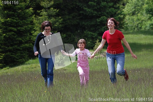 Image of happy girls running in nature