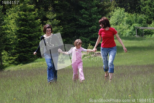 Image of happy girls running in nature