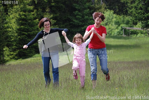 Image of happy girls running in nature