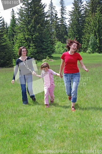 Image of happy girls running in nature