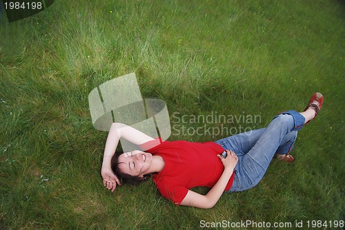 Image of woman laying in grass