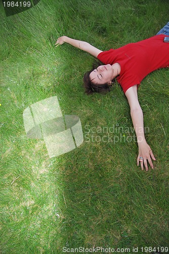 Image of woman laying in grass