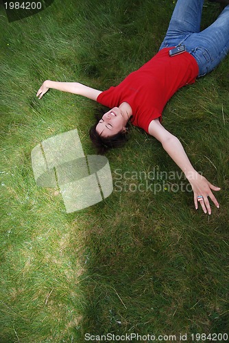 Image of woman laying in grass