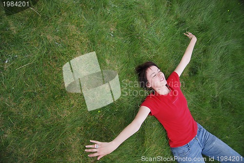 Image of woman laying in grass