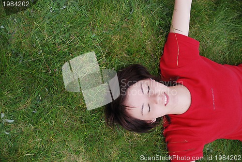 Image of woman laying in grass