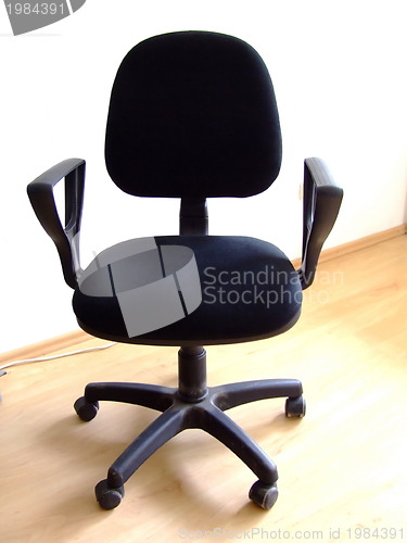 Image of black office chair on parquet