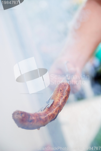 Image of sausages on grill