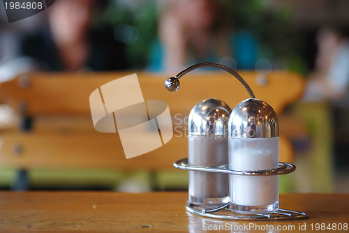 Image of salt and paper shaker in restaurant