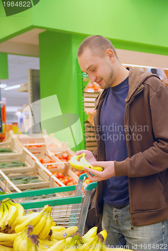 Image of smiling man in supermarket