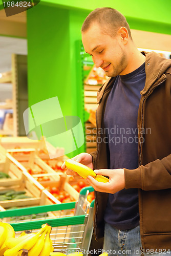 Image of smiling man in supermarket