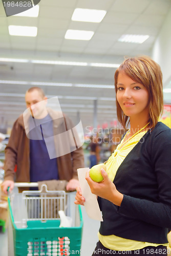 Image of happy couple in shopping