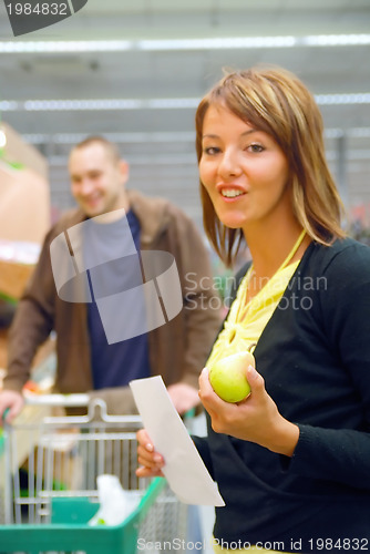 Image of happy couple in shopping